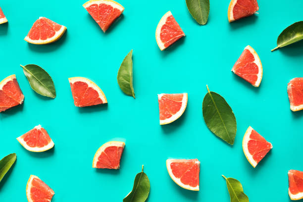 Top view of red organge fruit and leaves on blue teble background.concepts ideas of fruit,vegetable