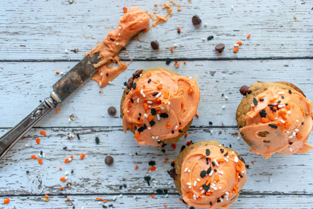 istock Orange and black pumpkin cupcakes 1055182152
