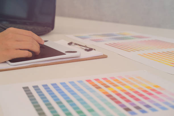 istock interior designer drawing on graphic tablet at office. artist working with computer at workplace. photographer retouch photo. design creativity concept 1055182174