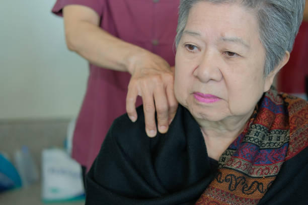 istock physiotherapist massage old woman shoulder 1055182412