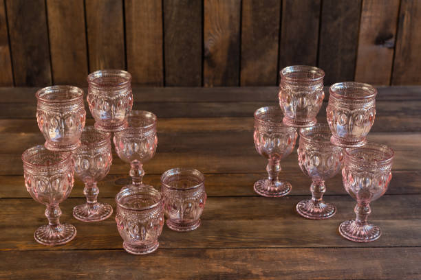 istock Beautiful glasses on a dark wooden background 1055183084