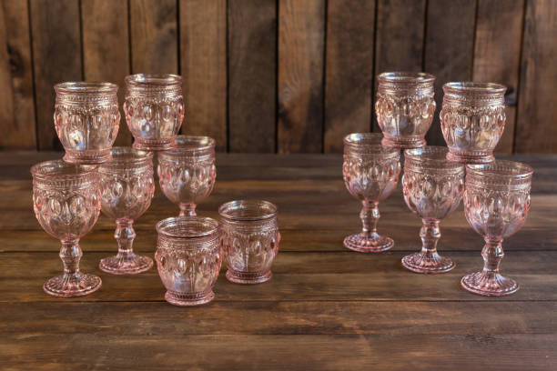 istock Beautiful glasses on a dark wooden background 1055183096