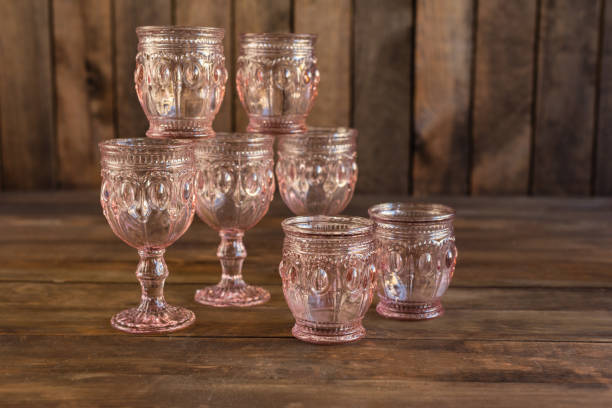 istock Beautiful glasses on a dark wooden background 1055183110