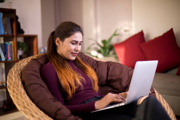 istock Woman working on laptop at home 1055192040