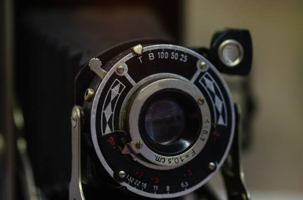 istock Old film camera on a black  background 1055202530