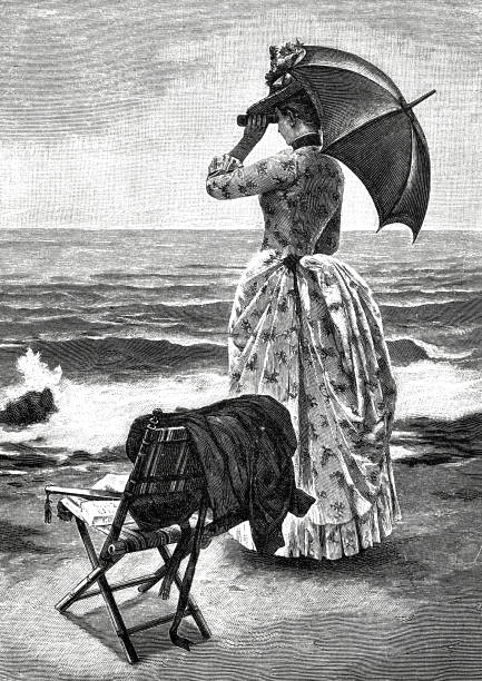 istock Elegant woman with binoculars and umbrella standing on the beach 1055208006