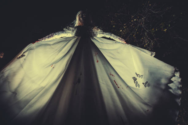 istock Witch in bloody white dress 1055210526
