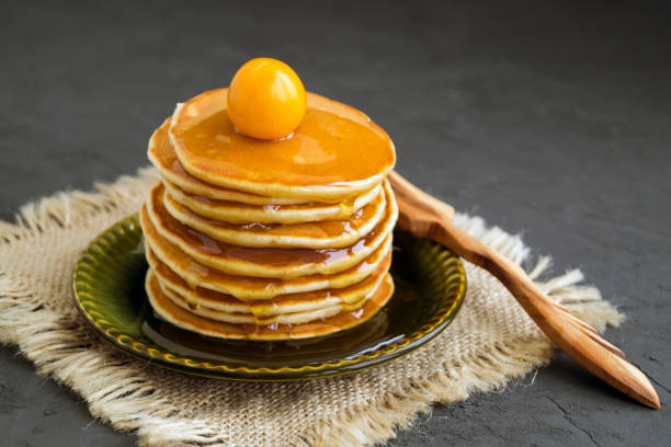 istock Pancakes with honey on a gray background 1055211070