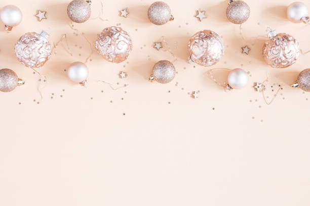 istock Christmas composition. Christmas decorations on pastel beige background. Flat lay, top view, copy space 1055213630