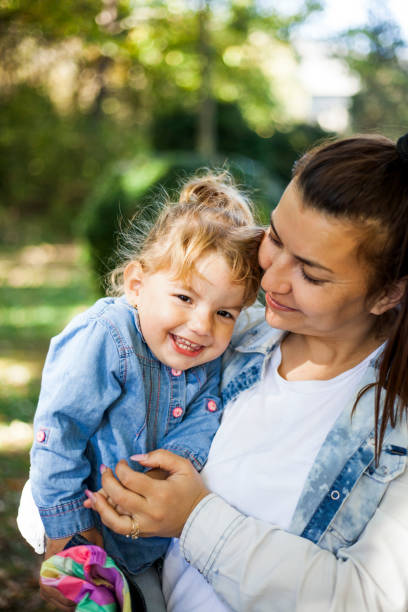 istock mother and daughter playing outdoor 1055213642