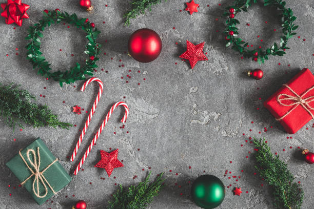 istock Christmas composition. Gifts, fir tree branches, red decorations on black background. Christmas, winter, new year concept. Flat lay, top view, copy space 1055214602