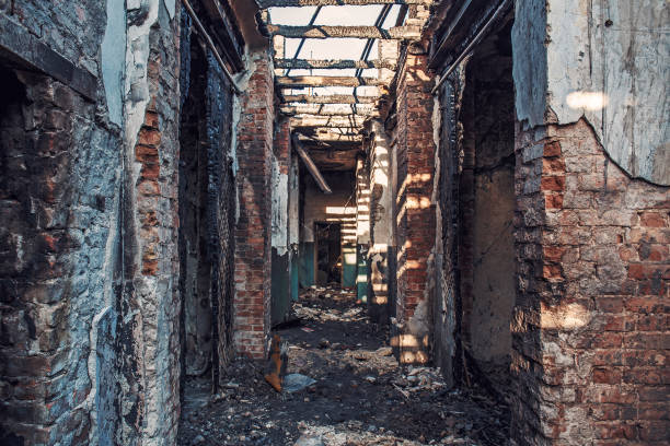 istock Burned house interior after fire, ruined building room inside, disaster or war aftermath 1055216090