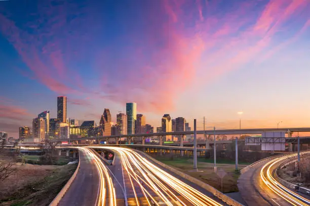 Houston, Texas, USA downtown skyline over the highways at dusk.