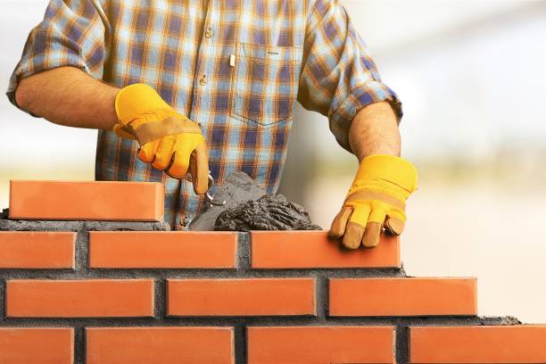 Masonry. Portrait of young profession man at work hand with a plaster spatula stock pictures, royalty-free photos & images