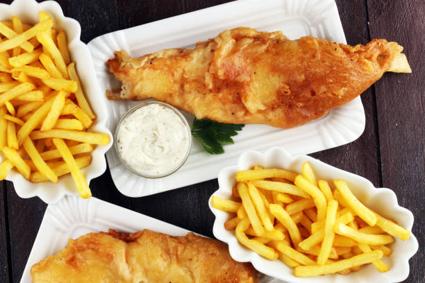 istock traditional British fish and chips consisting of fried fish, potato chips and mayonnaise 1055219992