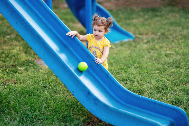 istock Little Toddler Playing At Playground Outdoors In Summer 1055221696