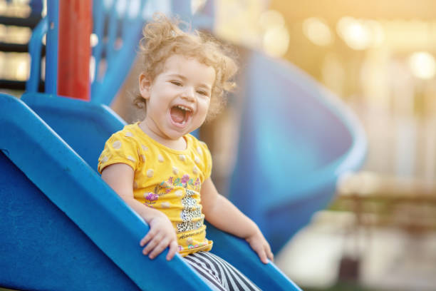 istock Little Toddler Playing At Playground Outdoors In Summer 1055222012