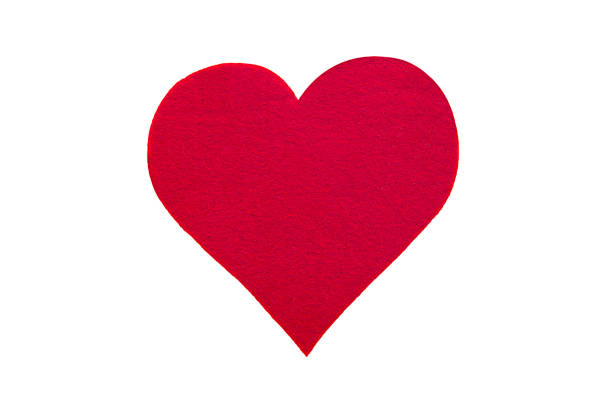 istock Tiny red heart sign isolated on wooden background. 1055222396