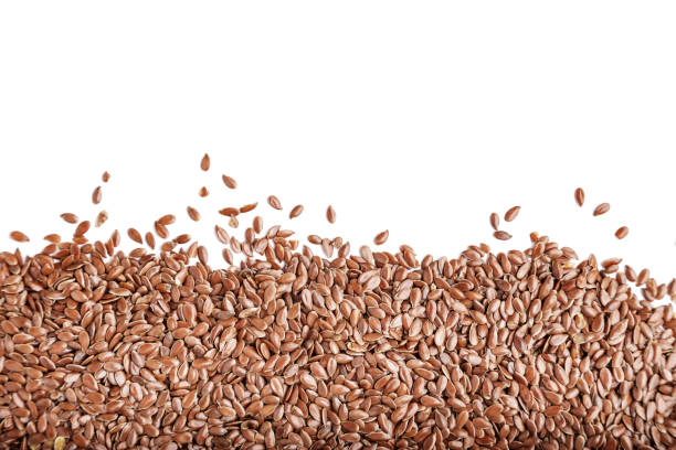istock flax seeds isolated on white background. 1055222628