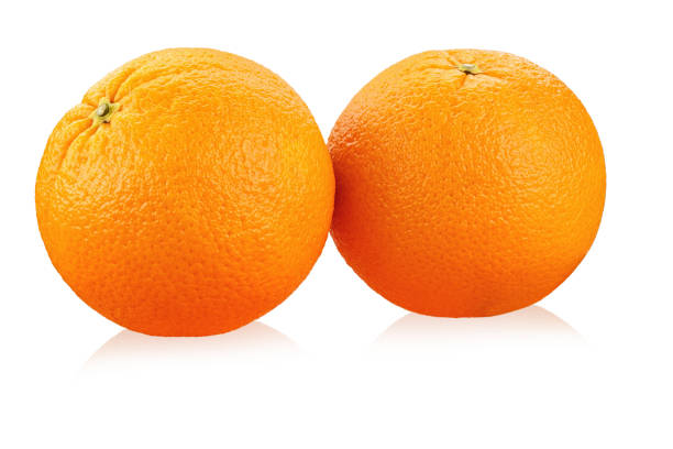 istock two ripe oranges on a white background isolated. clearly visible texture of the fruit. 1055225082