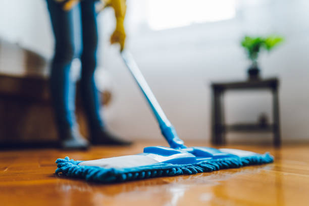 Young woman cleaning house Close-up of young woman mopping the floor surface disinfection stock pictures, royalty-free photos & images