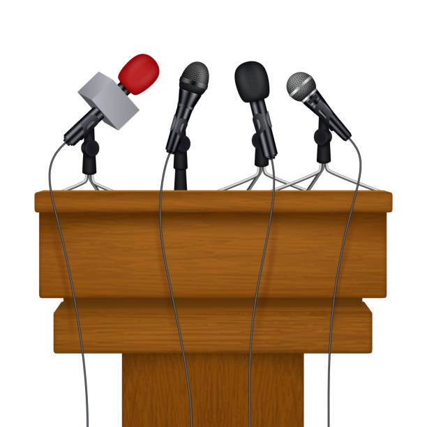 istock Press conference stage. Meeting news media microphones vector realistic pictures 1055226748