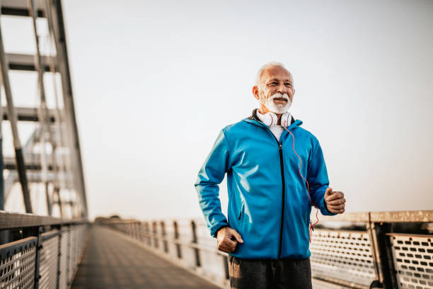 istock Senior man running over the bridge 1055228718