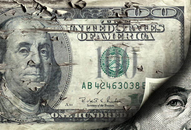 istock close up old one hundred dollar bill curled up from corner 1055229600