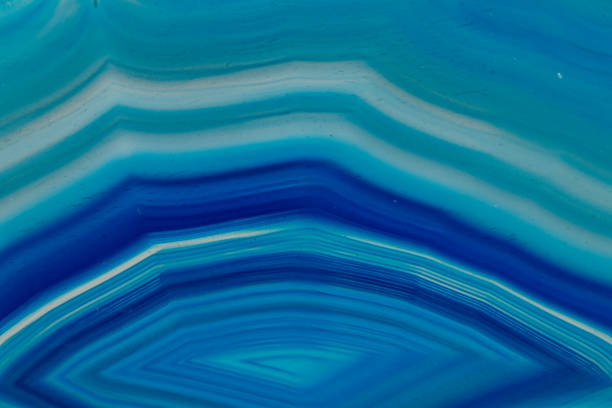 istock Macro mineral stone Blue Agate breed a white background 1055238054