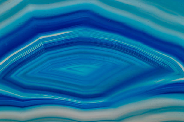 istock Macro mineral stone Blue Agate breed a white background 1055238104
