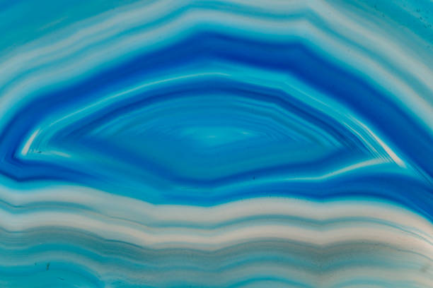 istock Macro mineral stone Blue Agate breed a white background 1055238358