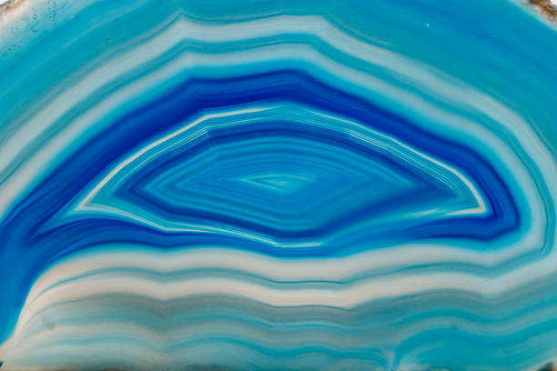 istock Macro mineral stone Blue Agate breed a white background 1055238394