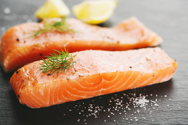istock Raw salmon fish on black slate 1055244506