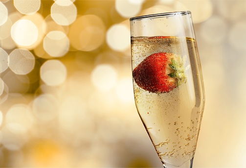 Closeup of stylish champagne flutes filled with