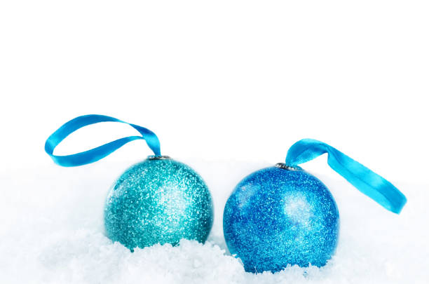 istock Christmas colored balls on snow isolated background 1055245144