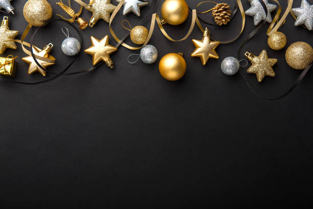 istock Golden silver christmas deco on black 1055247434