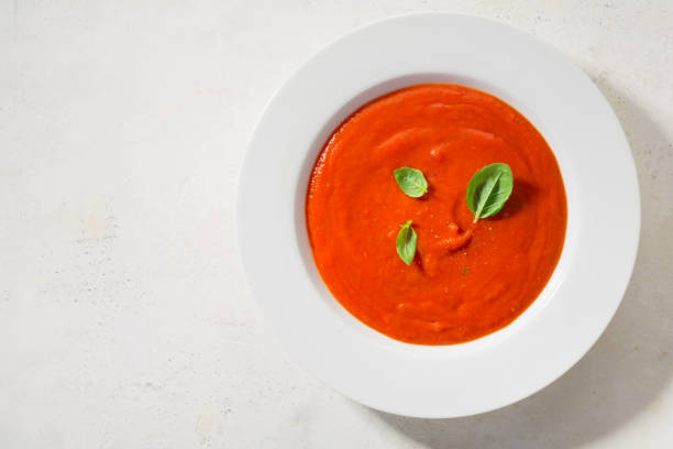 istock Creamy tomato soup served in bowl 1055249118
