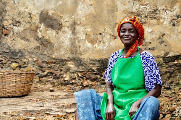 istock Senior Woman Sitting By Old Wall 1055249838