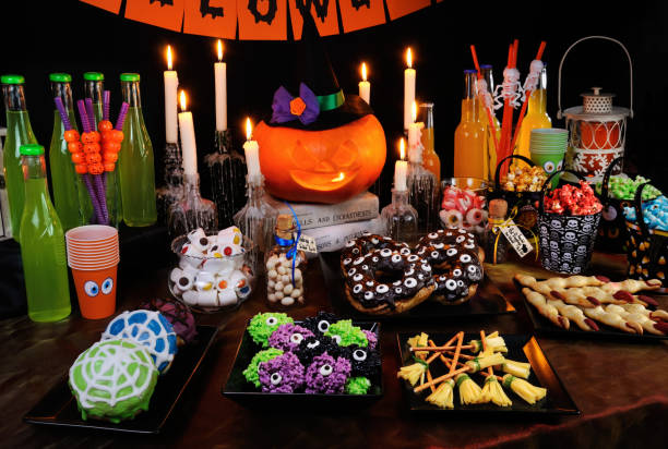istock Buffet table with sweets and drinks, cooked  and decorated in honor of Halloween 1055253302