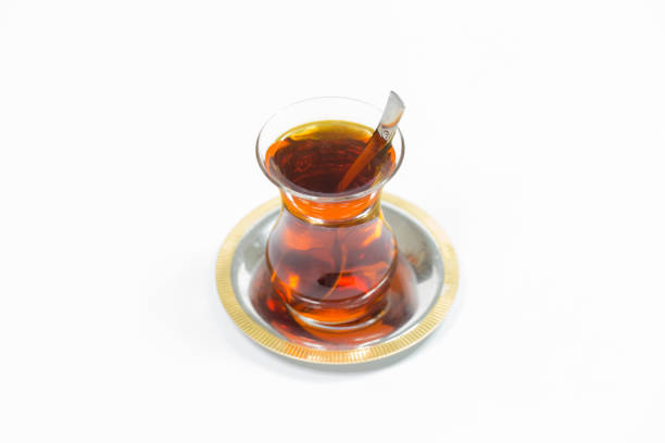 istock glass of Turkish tea isolated on white 1055255262