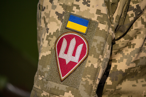 Kiev, Ukraine - October 14, 2018: Chevron from Ukrainian a flag and the coat of arms on a uniform of the soldier of the Ukrainian army