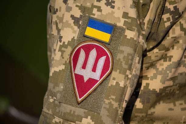 Chevron from Ukrainian a flag and the coat of arms on a uniform of the soldier of the Ukrainian army Kiev, Ukraine - October 14, 2018: Chevron from Ukrainian a flag and the coat of arms on a uniform of the soldier of the Ukrainian army donets basin photos stock pictures, royalty-free photos & images