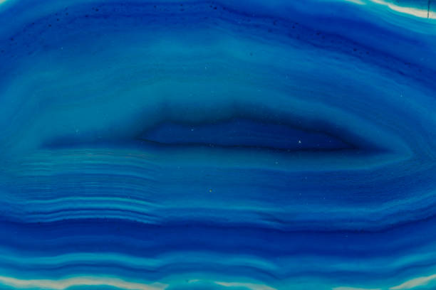 istock Macro mineral stone Blue Agate breed a white background 1055260308