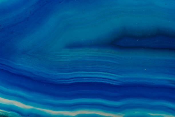 istock Macro mineral stone Blue Agate breed a white background 1055260686
