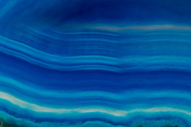 istock Macro mineral stone Blue Agate breed a white background 1055260800