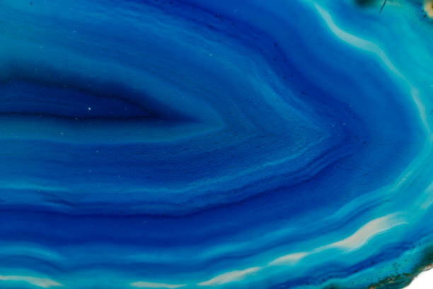 istock Macro mineral stone Blue Agate breed a white background 1055260936