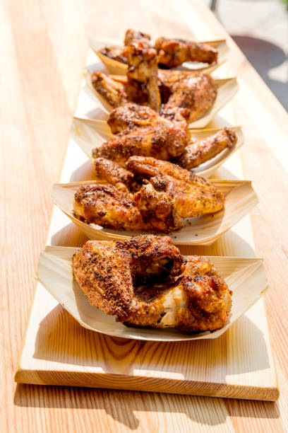 istock Portion of chicken wings grilled in trays 1055266888