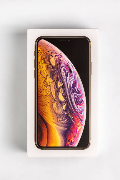 latest iphone xs in unopened box on white table. newest apple smartphone on white branded box in mobile store. - store application software iphone mobile phone imagens e fotografias de stock