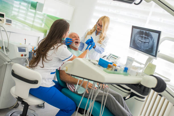 istock Senior man at the dentist 1055272836