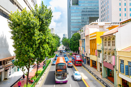 Elevated view of traffic on Singapore city street with modern colorful architecture